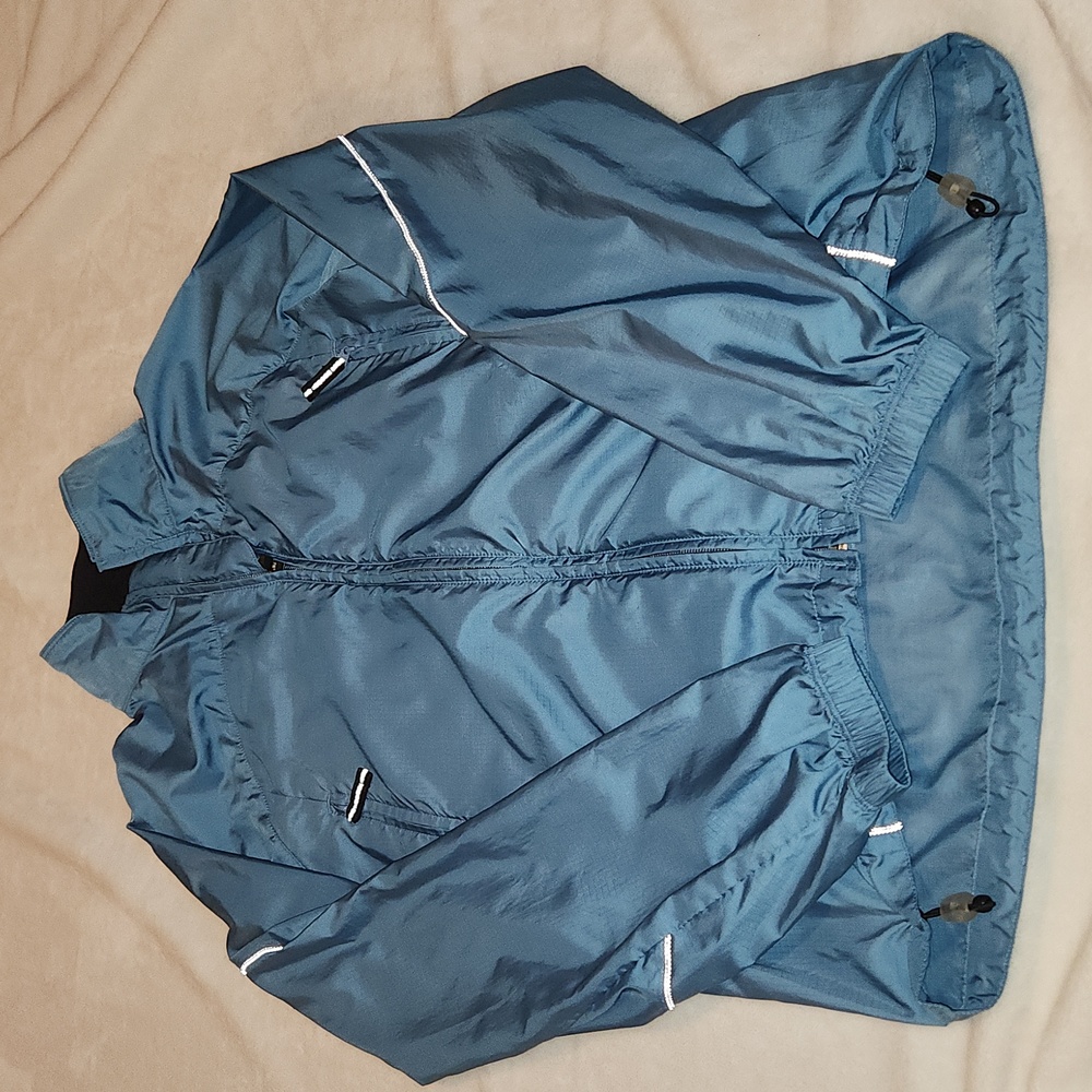 REI women's medium size windbreaker/rain jacket, reflective details